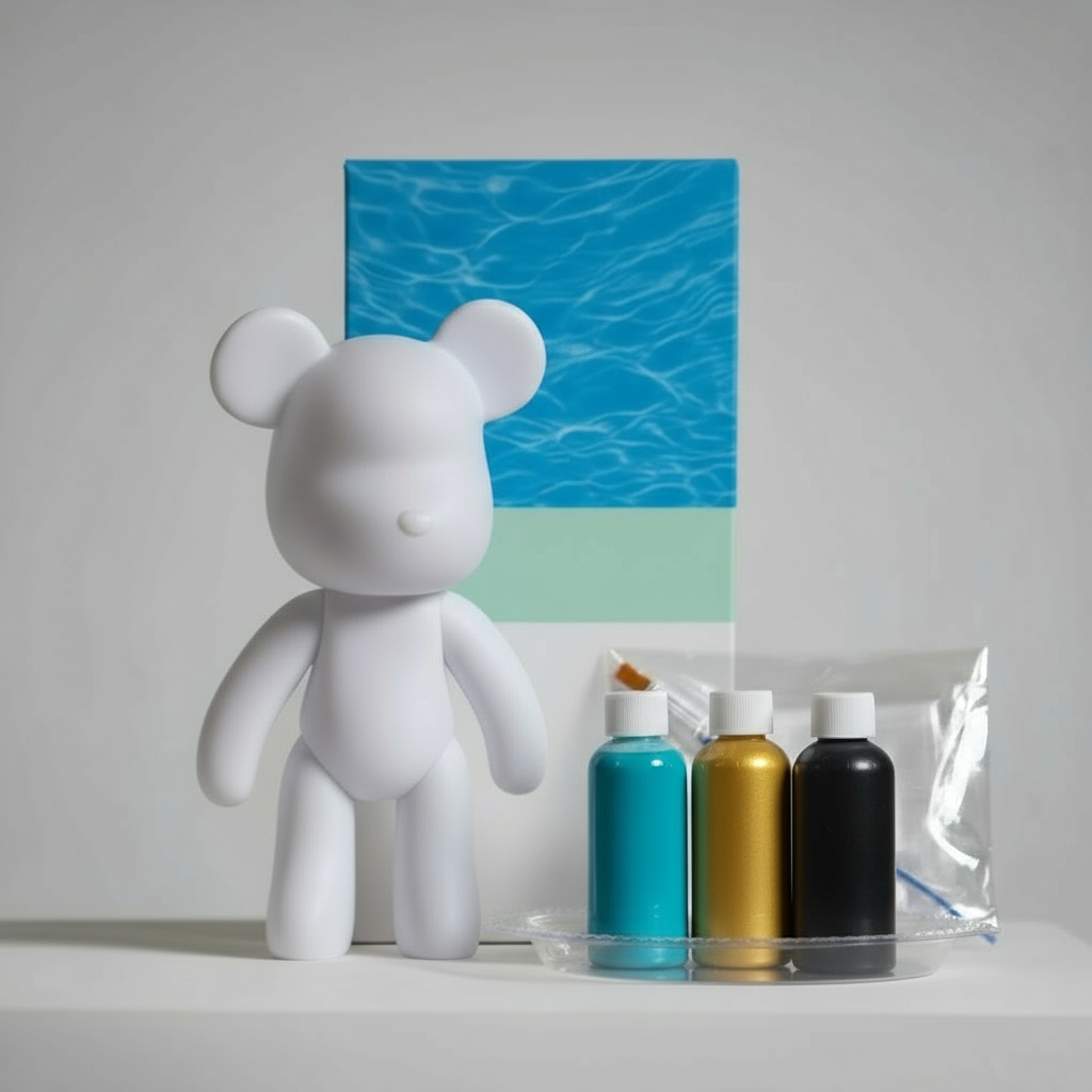 White bear figurine next to art supplies on a gray surface with a box in the background.