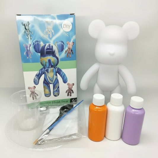 White bear figure with paint bottles and supplies on a gray background